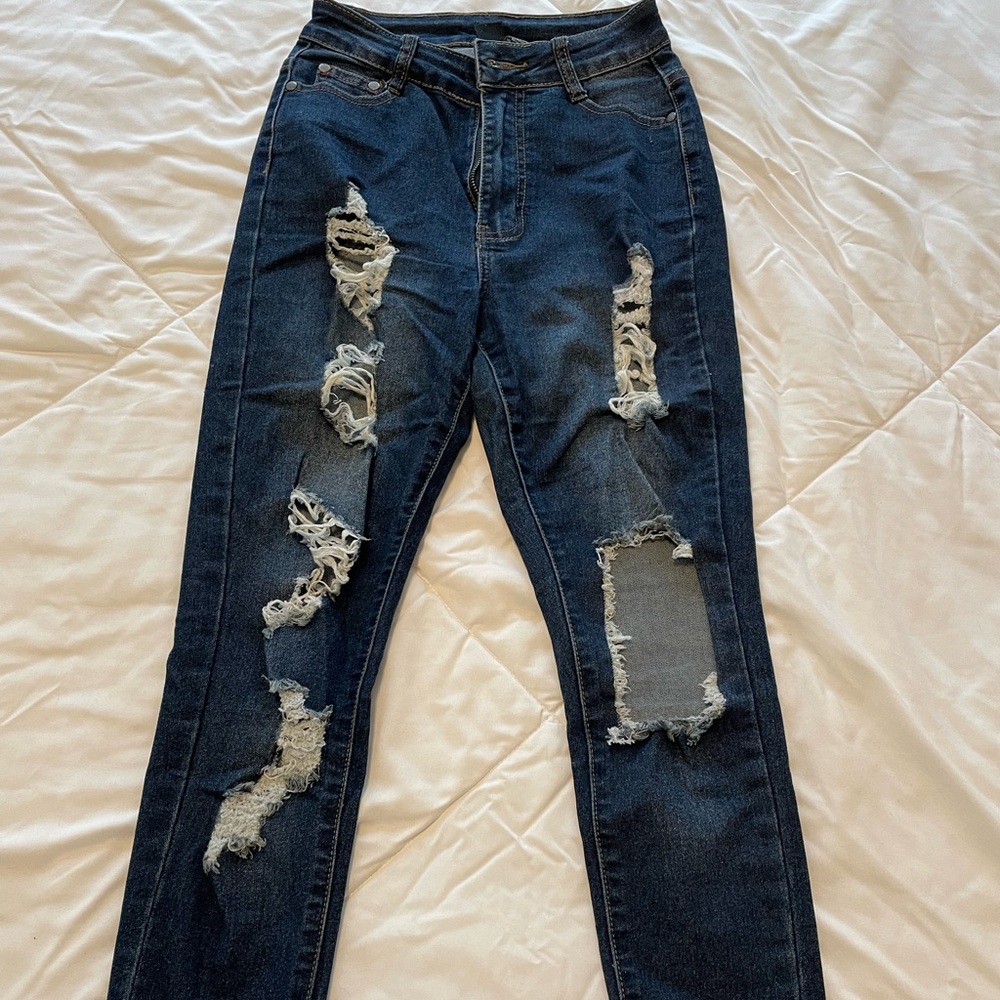 Distressed dark wash jeans